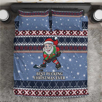 Blue Christmas bedding set with hockey Santa elf, snow dots, and festive border patterns.
