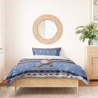 Blue Christmas bedding set with hockey Santa elf on duvet and matching shams.