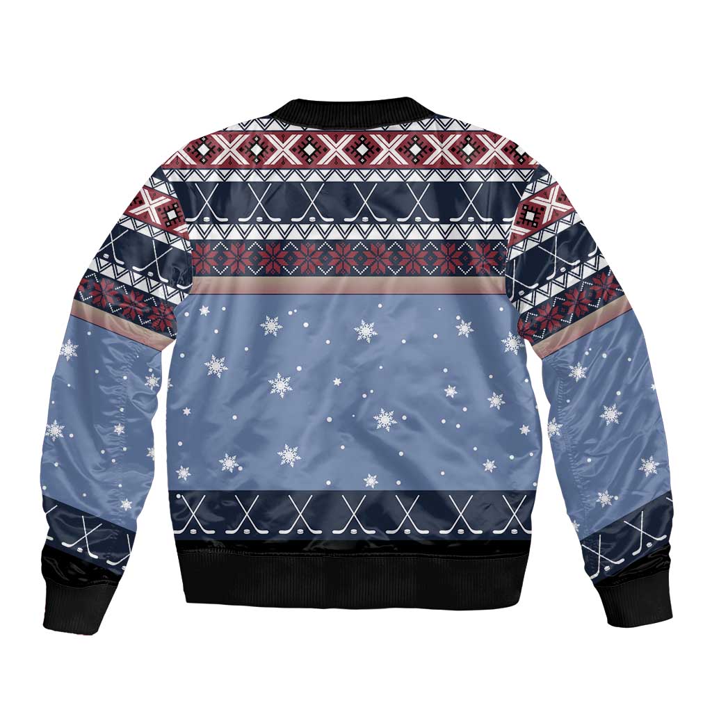 Unisex blue Christmas bomber jacket, back view with festive snowflake pattern, ribbed hem