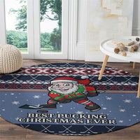 Blue round Santa hockey carpet with Santa graphic and 'Best Pucking Christmas Ever' at bottom