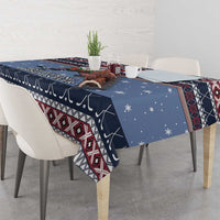 Navy blue Christmas tablecloth with Santa hockey design, red geometric border, and star accents