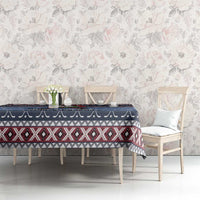 Navy blue Christmas tablecloth with red geometric border and white star motif on table