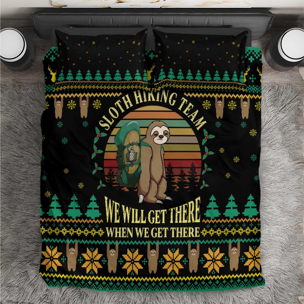 Black duvet cover with green, yellow, and brown sloth hiking holiday design and text