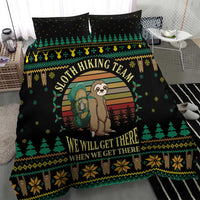 Black duvet close-up with sloth hiking illustration, tree motifs, and banner text
