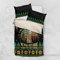 Black duvet set with sloth hiking illustration, green trees, and two matching pillowcases