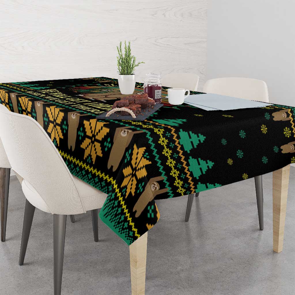 Black tablecloth with sloth and mountain hiking print in green and yellow