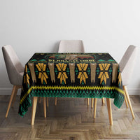 Black tablecloth with green and yellow zigzag motif and We will get there text