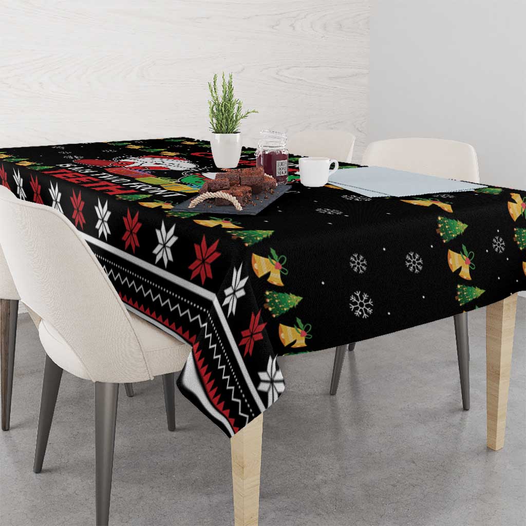 Black holiday tablecloth with snowflake dots and red-white-green striped border