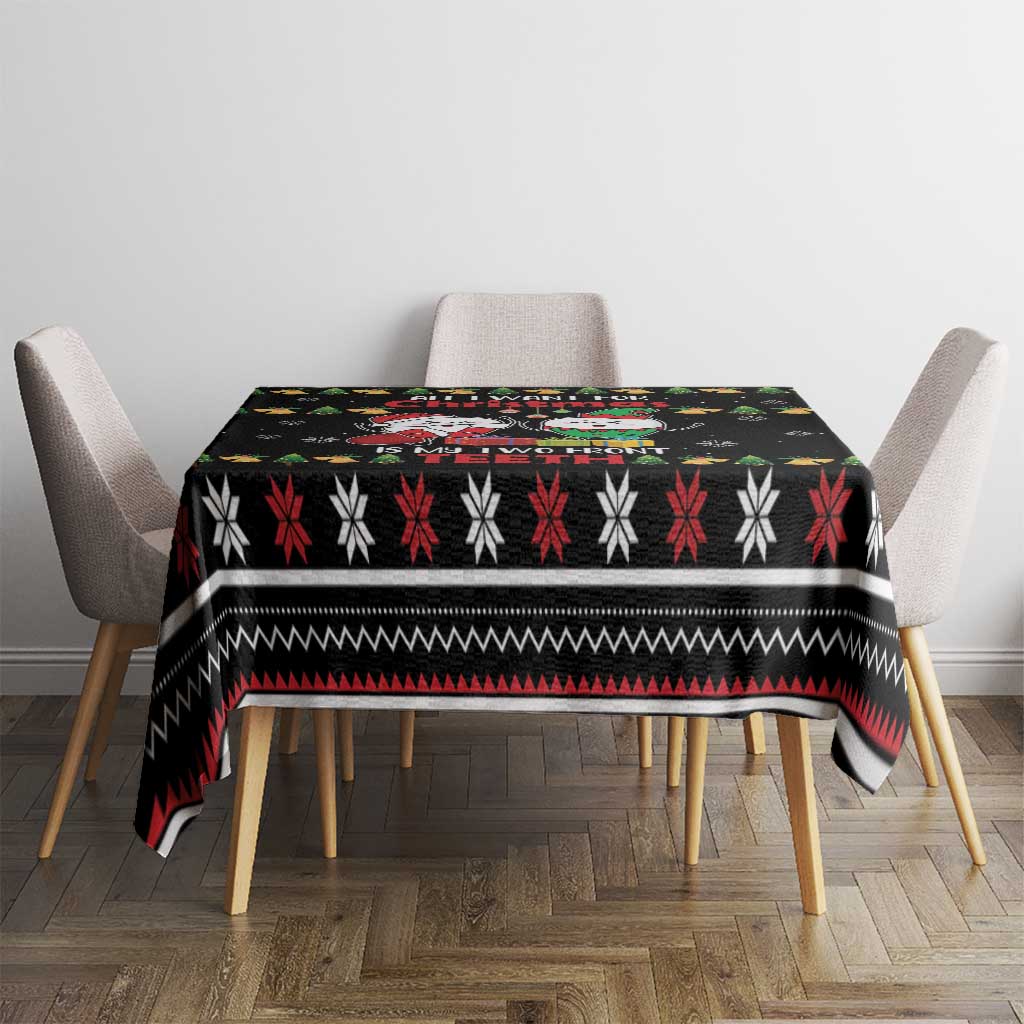 Black holiday tablecloth with striped snowflake band design on a dining table