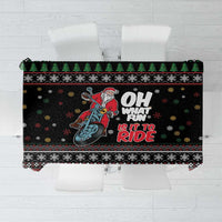 Black holiday tablecloth with Santa on motorcycle, snowflake and border patterns