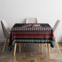 Black holiday tablecloth with zigzag knit design, snowflakes, and Santa motorcycle print