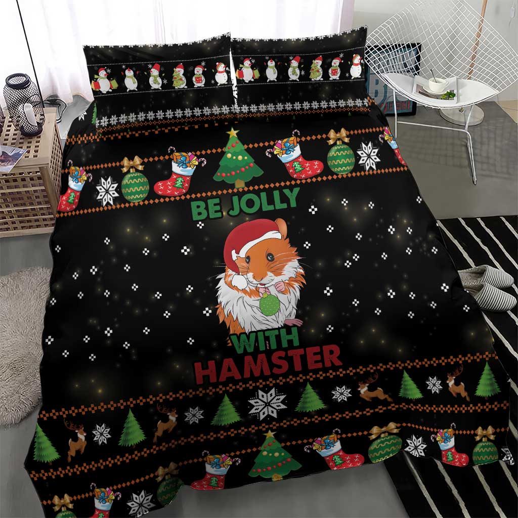 Black Christmas bedding set on bed with hamster Santa-like character, tree and snowflake trim.