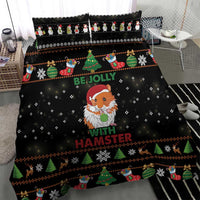 Black Christmas bedding set on bed with hamster Santa-like character, tree and snowflake trim.