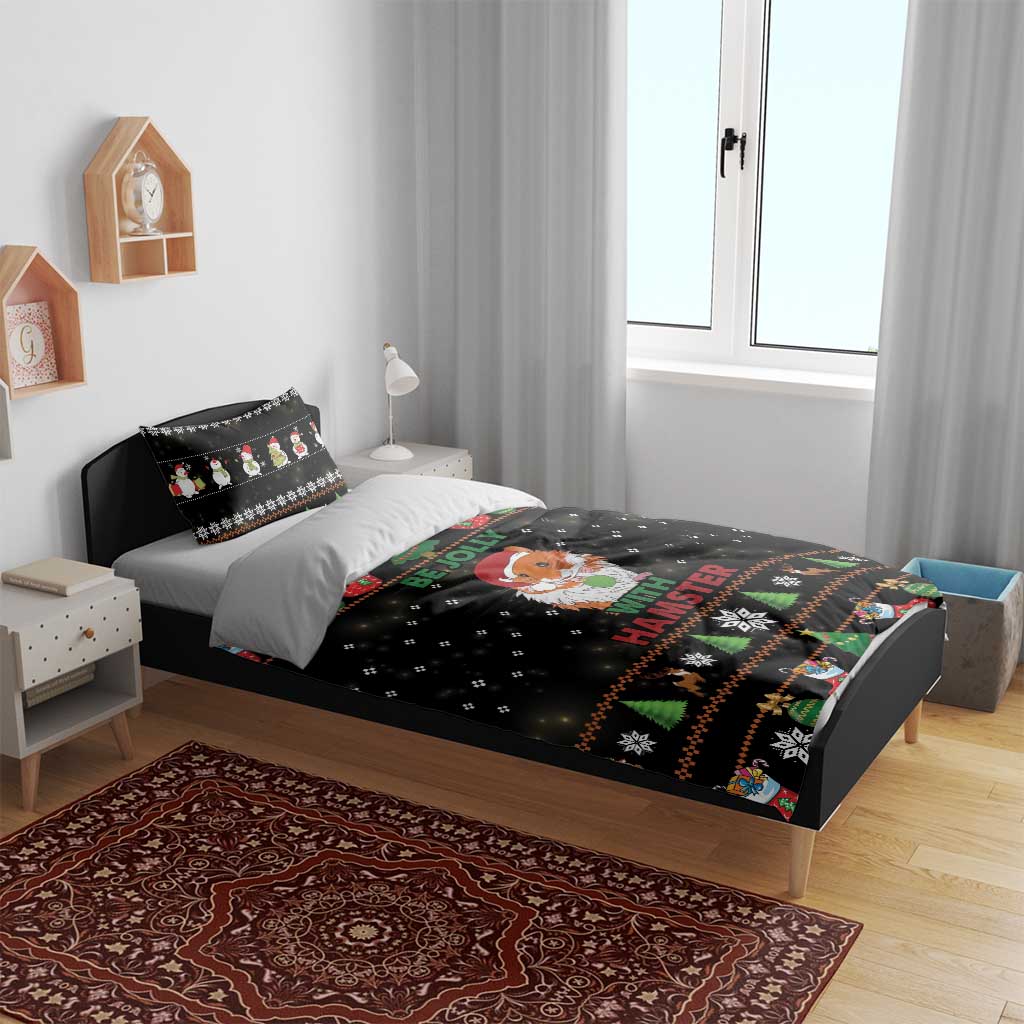 Black Christmas duvet set on bed with hamster graphic and festive border pattern.