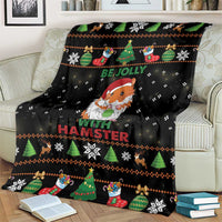 Black holiday blanket on cream chair with gnome hamster and 'With Hamster' lettering