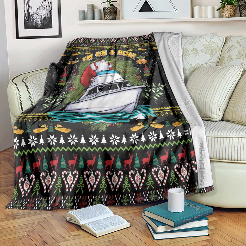 Black Christmas blanket with Santa on a boat and festive border pattern