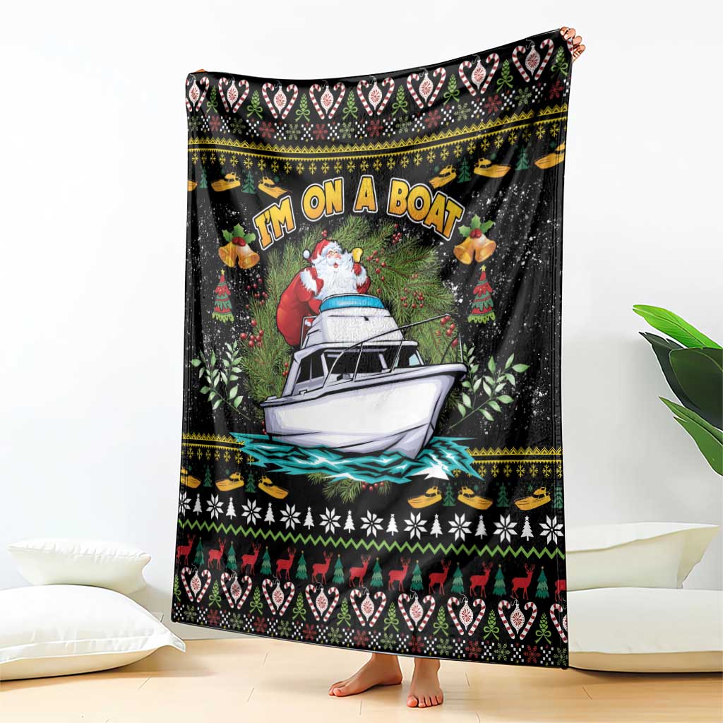 Black throw blanket featuring Santa driving a boat with holiday icons and trees