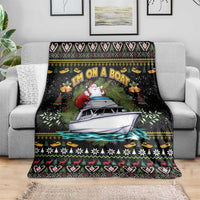 Black Christmas blanket with Santa and boat in center, layered with holiday trim
