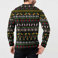 Black Christmas sweatshirt back with repeating holiday motifs: candy canes, hearts, fir trees