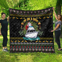 Black Christmas quilt with Santa-on-boat center, festive striped border and motifs