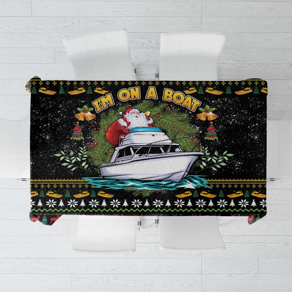 Black Christmas tablecloth with Santa, boat, and festive border print