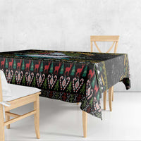 Black Christmas tablecloth with red, green, and white holiday pattern bands