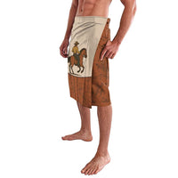 Terracotta western swim shorts with beige side panel and cowboy-on-horse artwork