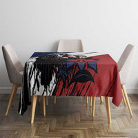 Red, navy, and black eagle bird tablecloth covering a dining table