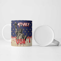 Blue and cream ceramic mug with Statue of Liberty, red drip accents, and white interior