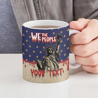 Ceramic mug in hand; blue starry design with Statue of Liberty and “Your Text”