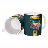 Dark teal ceramic mug with flamingo artwork, "YOUR TEXT" top, and open handle view