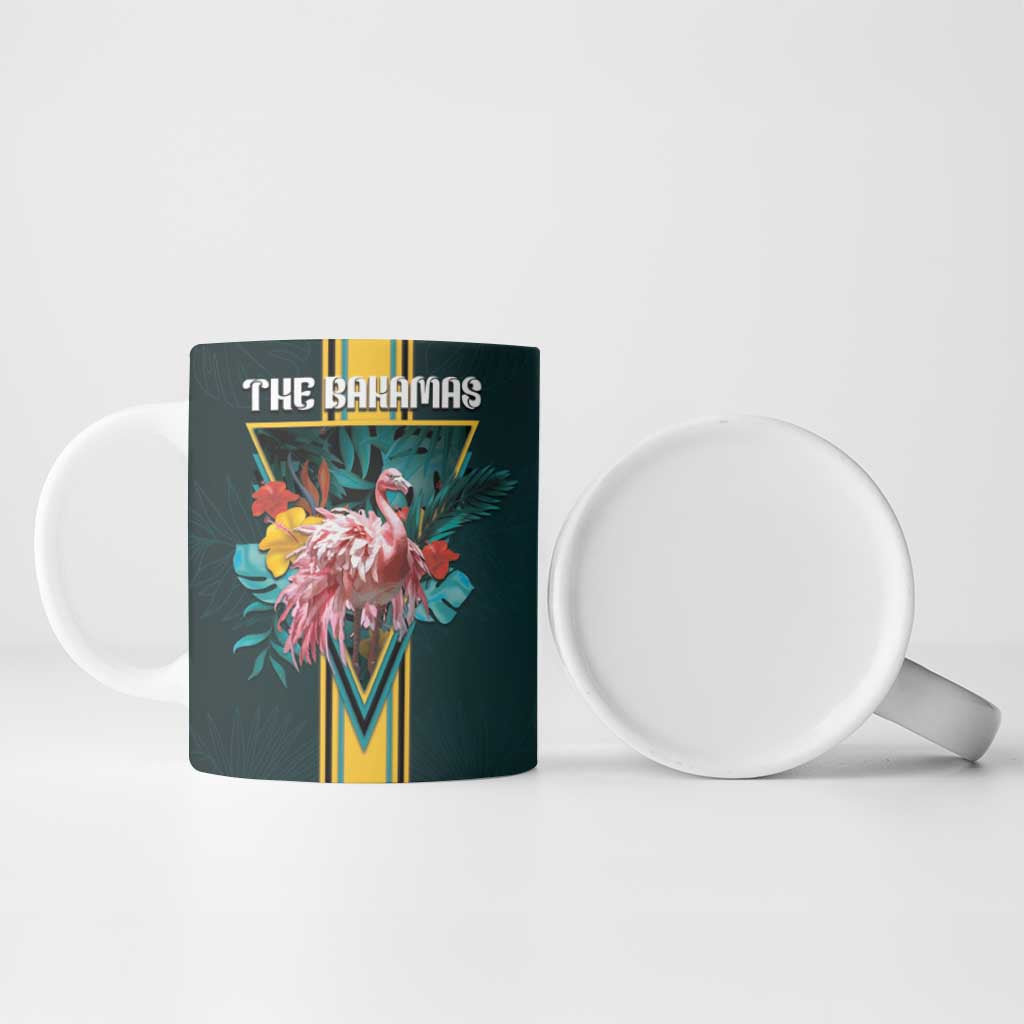 Dark teal ceramic mug with "THE BAHAMAS" flamingo graphic and visible white interior