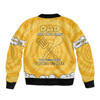 Yellow unisex bomber jacket with black ribbed hem and chef graphic back