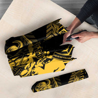Black and yellow patterned umbrella with hand folding, compact view