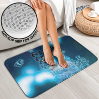 Blue ocean-themed bath rug with anti-slip grip for safe bathroom use
