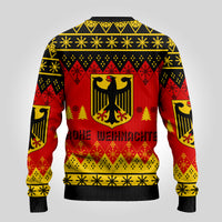 Ugly Christmas sweater, back view with eagle crest and red/black/yellow pattern