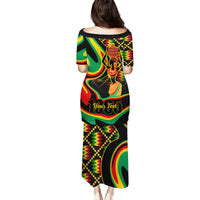 Black long dress with colorful Juneteenth graphic print, short sleeves, round neck (back)