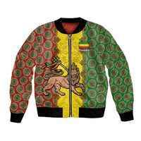 Unisex yellow bomber jacket with green/red circular pattern and lion emblem, ribbed trim