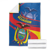 Ecuador flag blanket with coat of arms and eagle, folded beside white towels