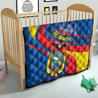 Ecuador quilt laid on wooden baby bed, blue with yellow crescent and red diagonal stripe