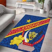 Blue rectangular area rug corner view with CONGO text, leopard emblem and PAIX TRAVAIL