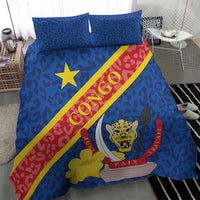 Blue bedding set on bed with leopard pattern, Congo flag diagonal stripe, star and leopard emblem