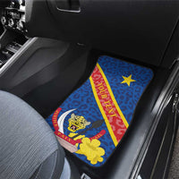 Blue leopard-print car floor mat with crest and red ribbon, rear seat