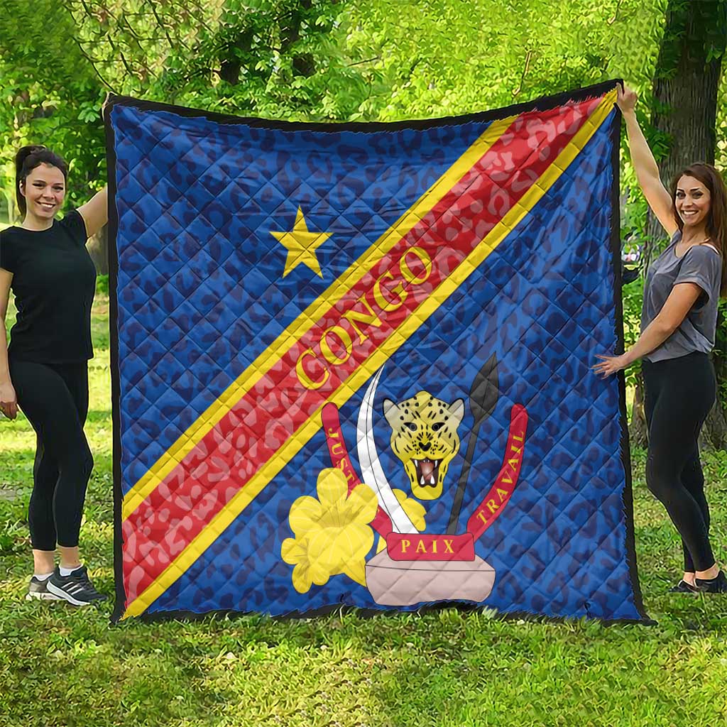 Blue quilted Congo flag blanket with leopard crest, yellow flower, and diagonal stripes.