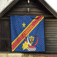 Blue quilt blanket hanging on wall with Congo diagonal flag stripe and leopard crest design.