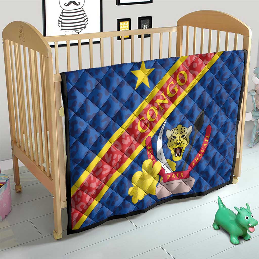 Blue quilted baby blanket with Congo flag diagonal stripe and leopard emblem inside shield.