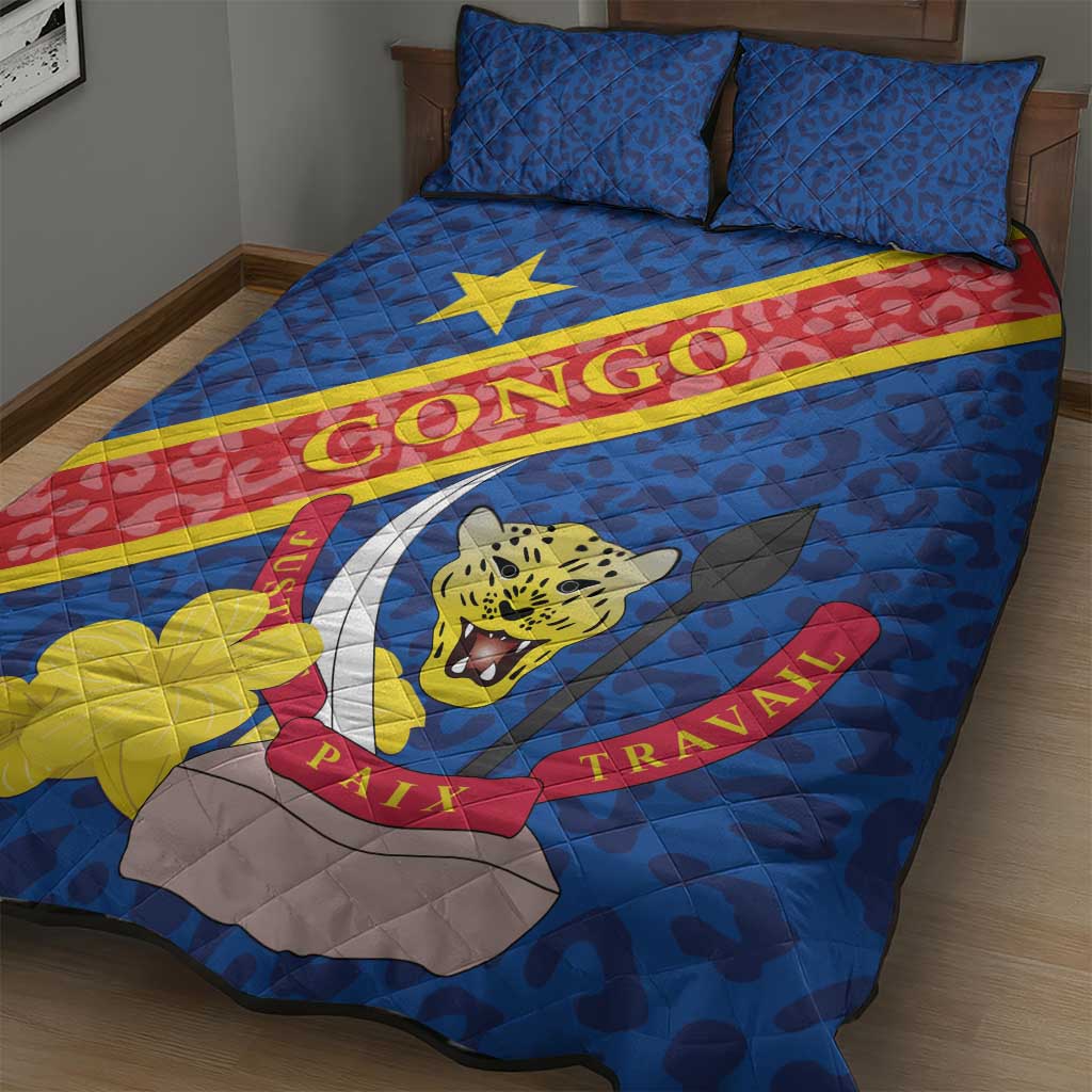 Blue quilt bed set with two pillows, large leopard mask emblem and yellow-red diagonal stripe