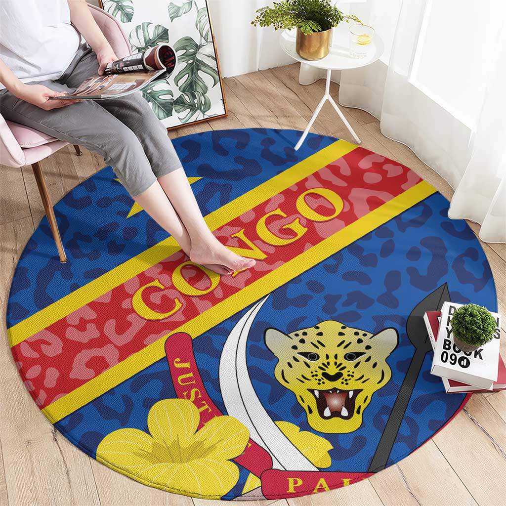 Blue round carpet with red/yellow stripe, leopard face graphic, star and floral motifs