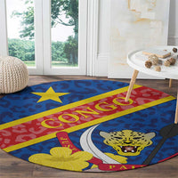 Blue round carpet with red/yellow stripe, leopard face, large star and leaf motifs