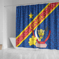 Blue shower curtain with CONGO diagonal stripe, leopard crest, and yellow flower detail